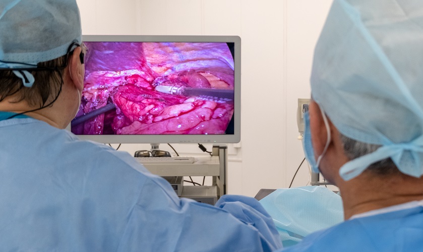 Broadcasting the work of two surgeons' doctors. Copy space. Endoscopy. Video image of the internal organs of the patient on the TV screen or high resolution monitor. Laparoscopy in the hospital.